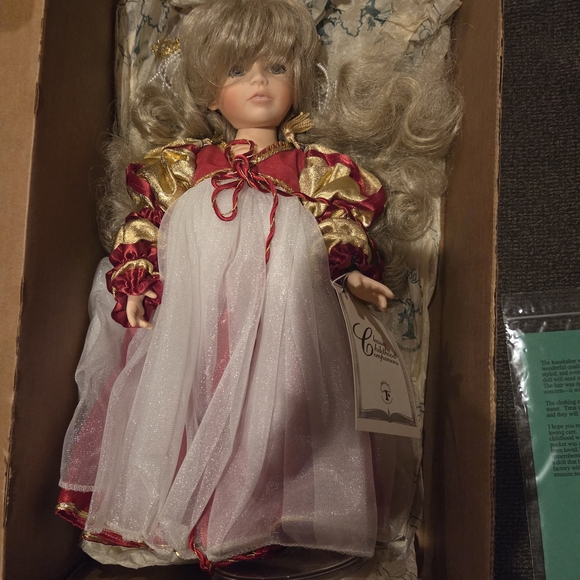 Elegant Red and Gold Doll